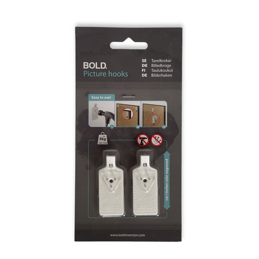 Bildekrok som passer alle typer rammer og nesten alle veggtyper. Monteres raskt med hammer – uten boring, plugger eller skruer.