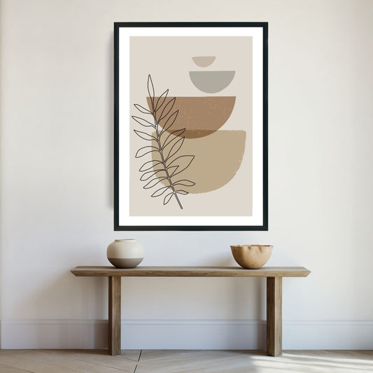 Brown Modern Art - abstrakt motiv i brune nyanser som plakat og lerret. Plakaten har en hvit kant som gir dybde og fremhever motivet. Illustrasjon viser plakat i sort ramme på en vegg.