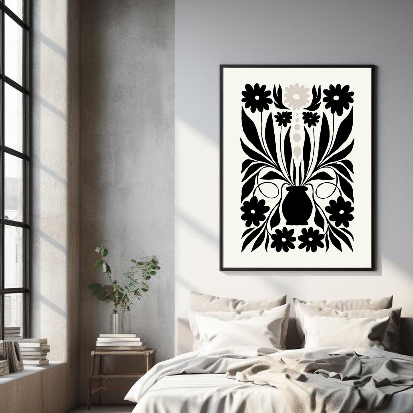 Illustrasjon av en grafisk plakat i abstrakt, floralt mønster i sort, beige og dempet hvit bakgrunn. Plakaten har en bred kant i samme som bakgrunnsfarge, og henger i sort ramme over en seng.