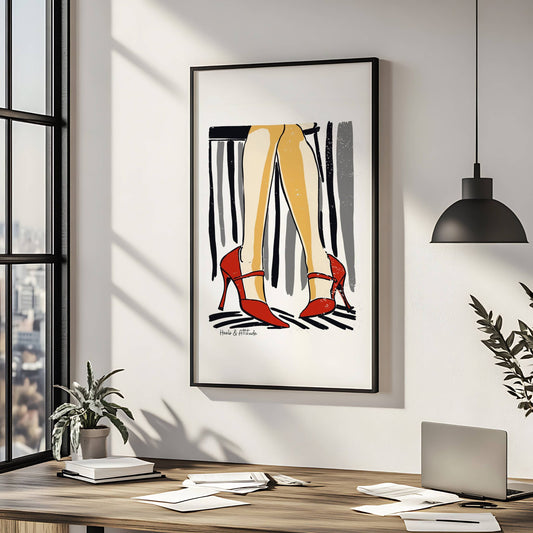 Gi hjemmet ditt en dose selvtillit med "Røde stiletter med attitude" – en kunstplakat som fanger eleganse i bevegelse. Illustrasjon viser plakat i sort ramme.