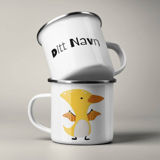 Emaljekrus stablet, med personlig navn på ene siden og dinosaurmotiv på andre siden