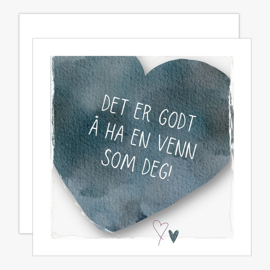 Kort med blått hjerte med tekst "Det er godt å ha en venn som deg". Konvolutt er inkludert.
