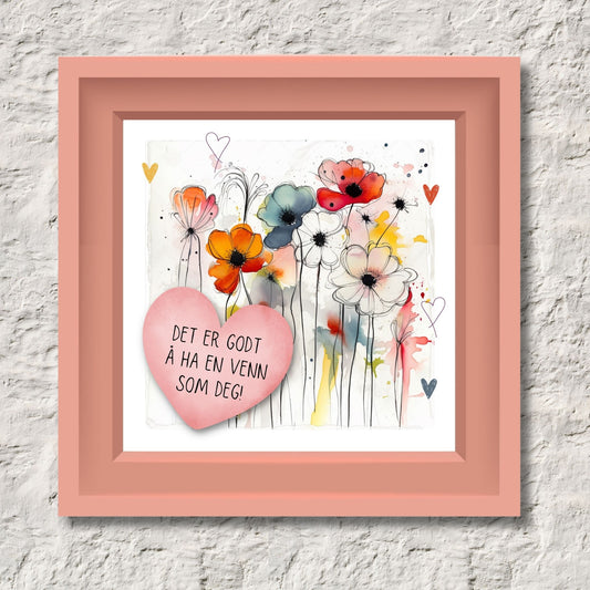 Plakat med rosa hjerte og tekst "Det er godt å ha en venn som deg" - og et motiv med blomster i gul, rød, hvit, blå og oransje. Med hvit kant på 1,5 cm. Illustrasjon viser plakat i rosa ramme.