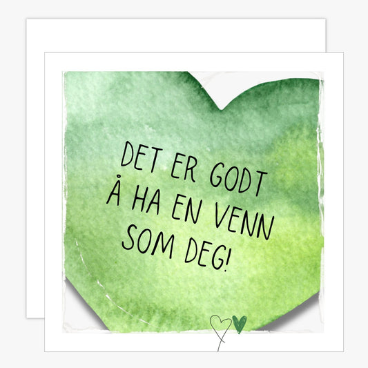 Kort med et grønt hjerte med tekst "Det er godt å ha en venn som deg". Konvolutt er inkludert.