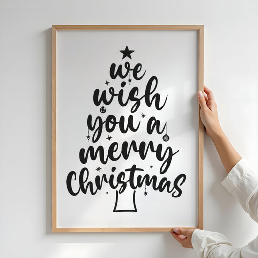 En klassisk og uttrykksfull juleplakat der teksten We Wish You a Merry Christmas er formet som et juletre. Illustrasjon viser plakat i ramme.