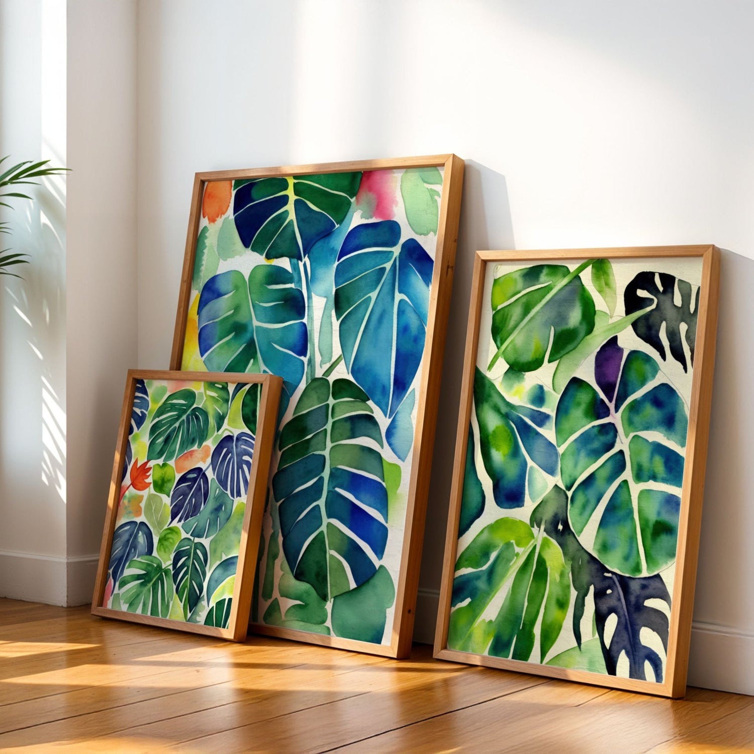 Botaniske Monstera-plakater i akvarell – grønne blader i ulike formater samlet mot vegg