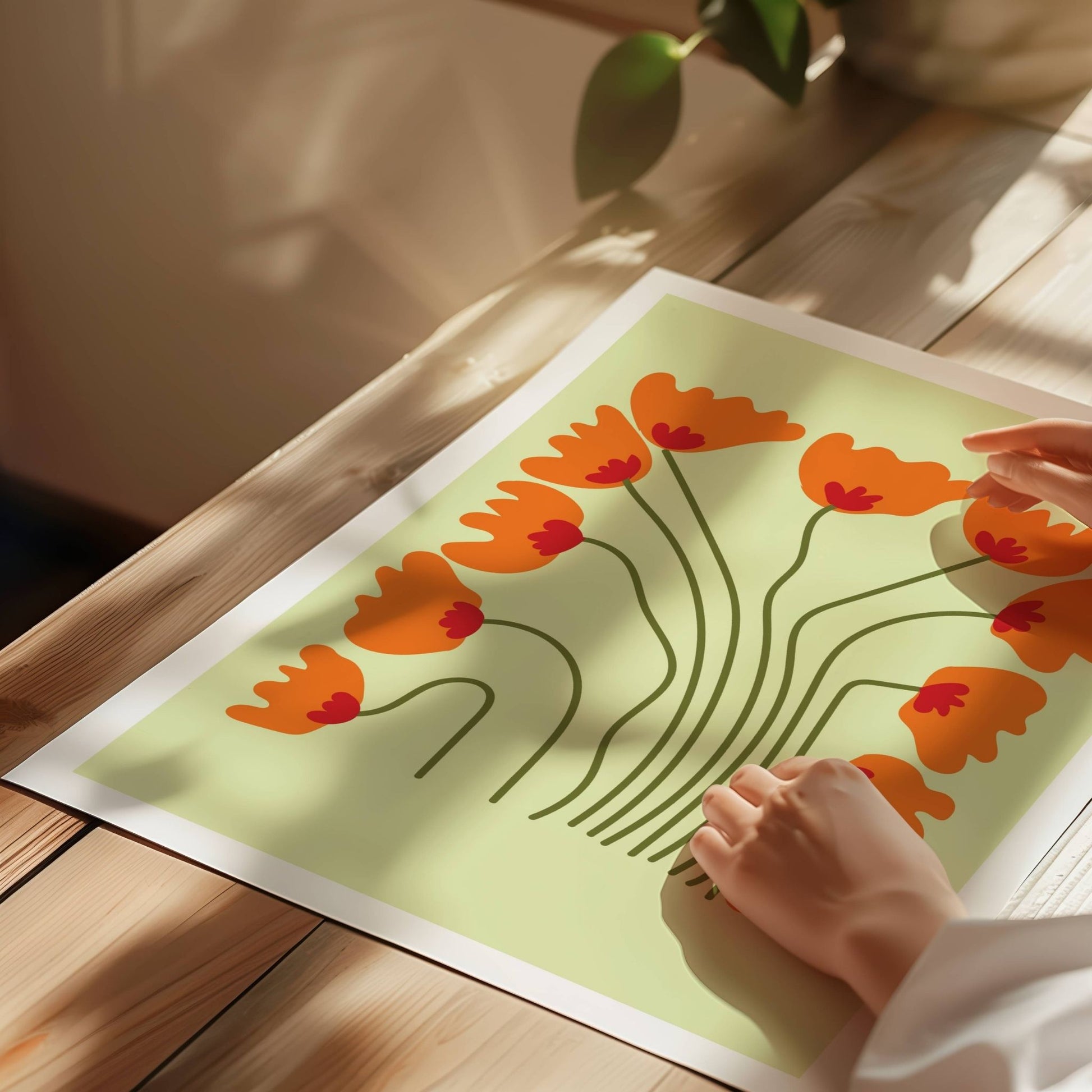 Bold Botanical No9 viser elleve oransje blomster med røde sentrum danser som en ramme rundt motivets myke midte. Lange, buede stilker skaper en følelse av bevegelse og rytme, mens den lyse bakgrunnen gir hele uttrykket en lett og leken atmosfære. Illustrasjon viser plakat på print.