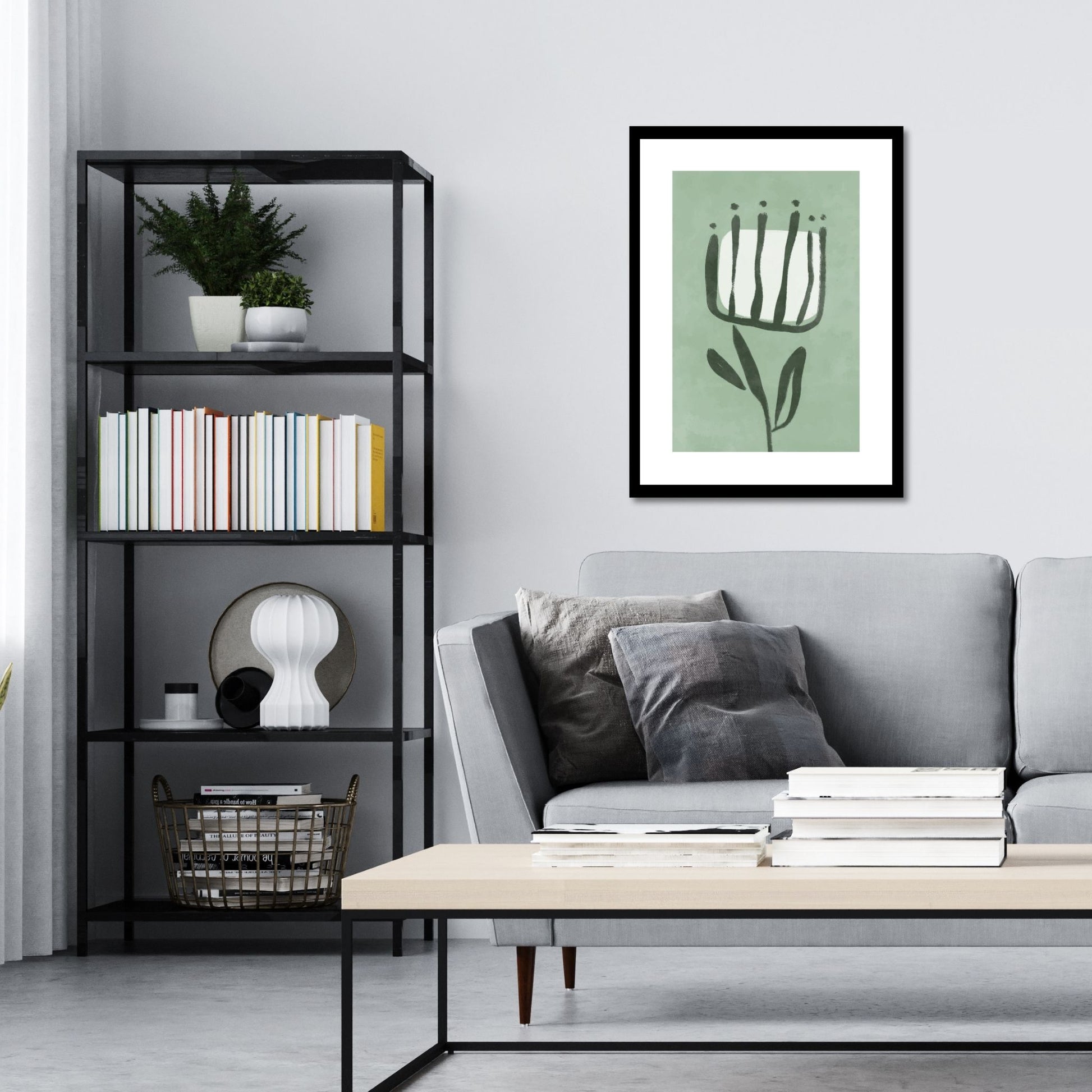 Green Abstract plakat. Med sine beroligende grønne toner og sofistikerte design, tilfører denne plakaten en følelse av ro og harmoni til ethvert rom. Illustrasjonen viser plakat i sort ramme på en vegg over en sofa.