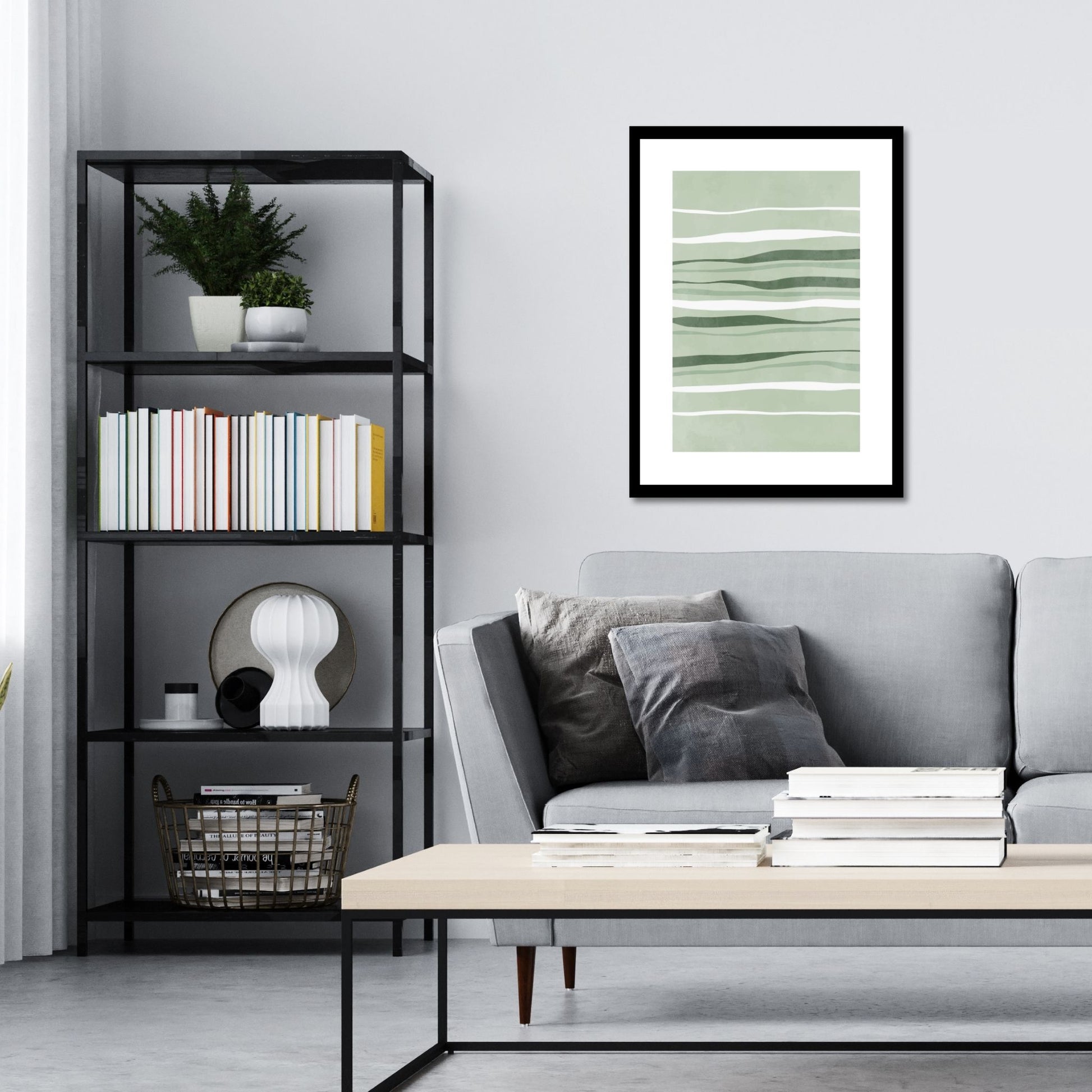 Green Abstract plakat. Med sine beroligende grønne toner og sofistikerte design, tilfører denne plakaten en følelse av ro og harmoni til ethvert rom. Illustrasjonen viser plakat i sort ramme på en vegg over en sofa.