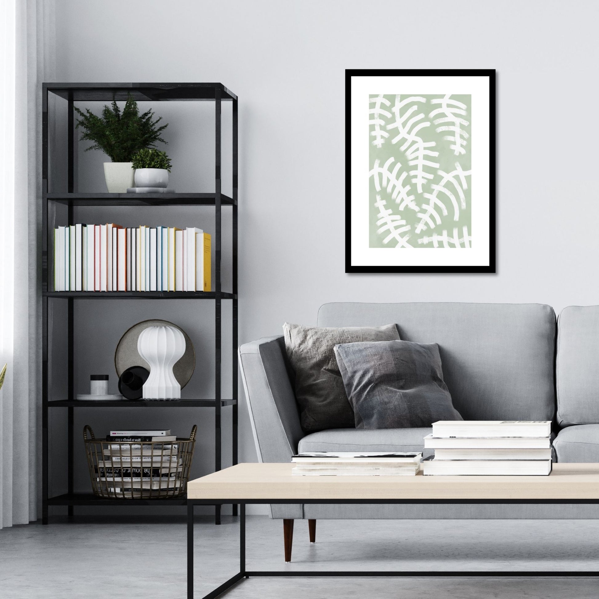 Green Abstract plakat. Med sine beroligende grønne toner og sofistikerte design, tilfører denne plakaten en følelse av ro og harmoni til ethvert rom. Illustrasjonen viser plakat i sort ramme på en vegg over en sofa.