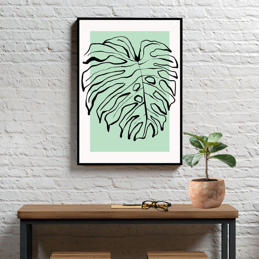 Forny hjemmet ditt med et snev av naturens skjønnhet med vår "Monstera Leaf" plakat og lerret. Illustrasjonsfoto viser motivet som plakat i svart ramme.