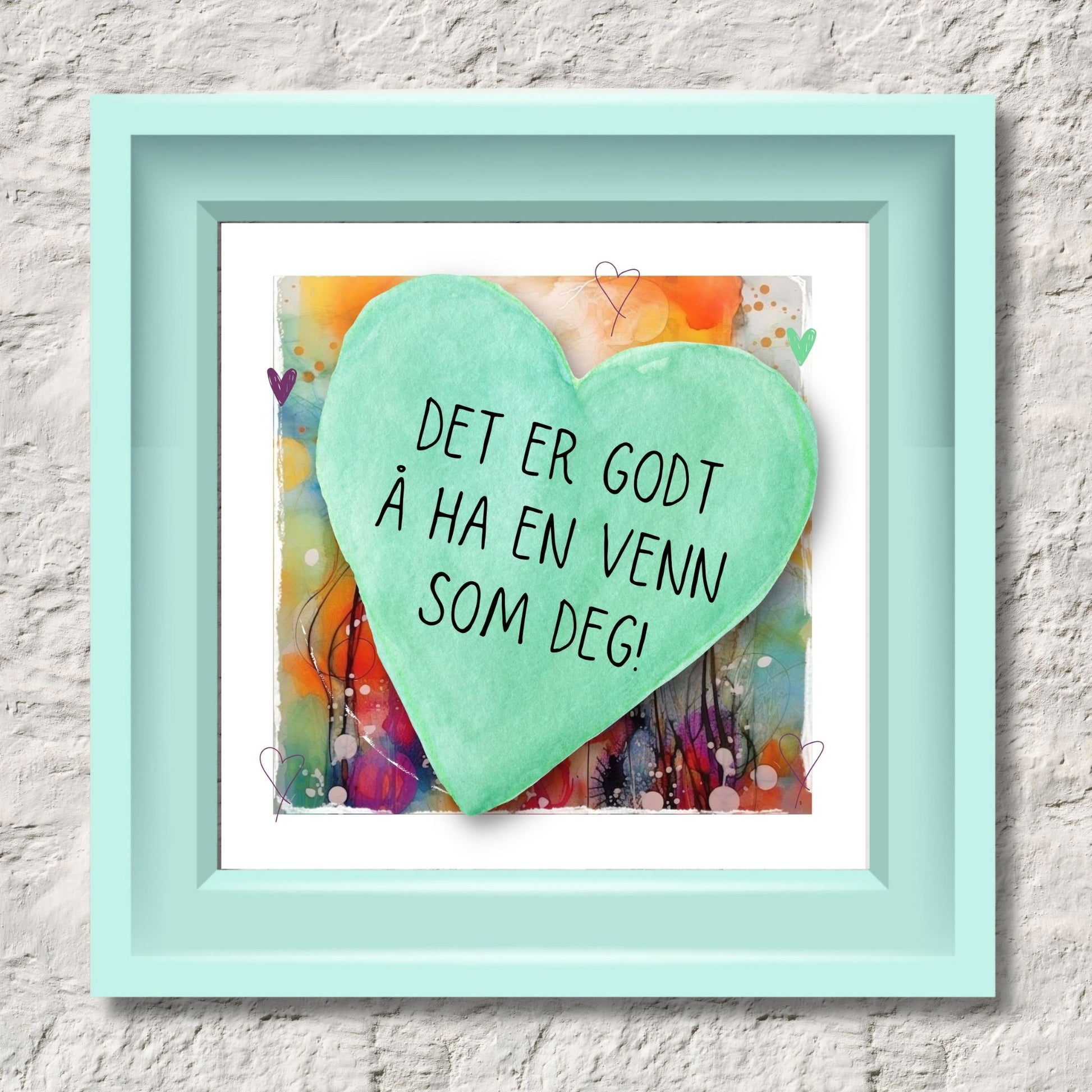 Plakat med lysegrønt hjerte og tekst "Det er godt å ha en venn som deg" - og et motiv med farger i grønn, blått og oransje. Med hvit kant på 1,5 cm. Illustrasjon viser plakat i lysegrønt ramme.