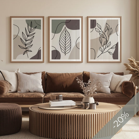 Botanical Lines Trio med tre botaniske plakater over sofa i varme naturtoner