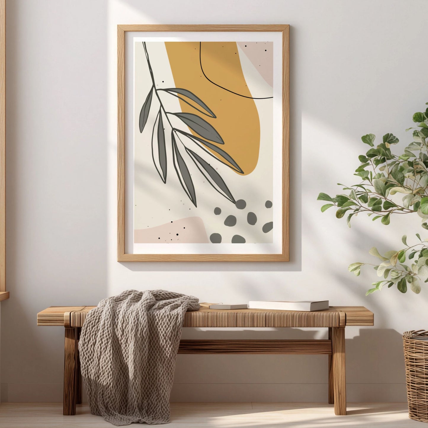 Falling Leaves botanisk plakat i eikeramme over trebenk i lyst interiør