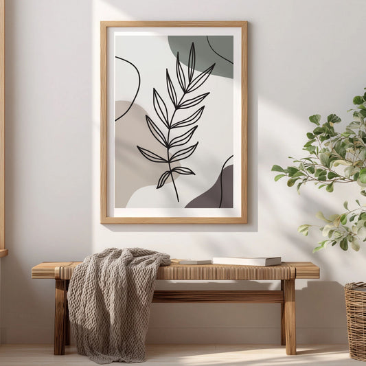 Gentle Branch botanisk plakat i eikeramme over trebenk i lyst interiør