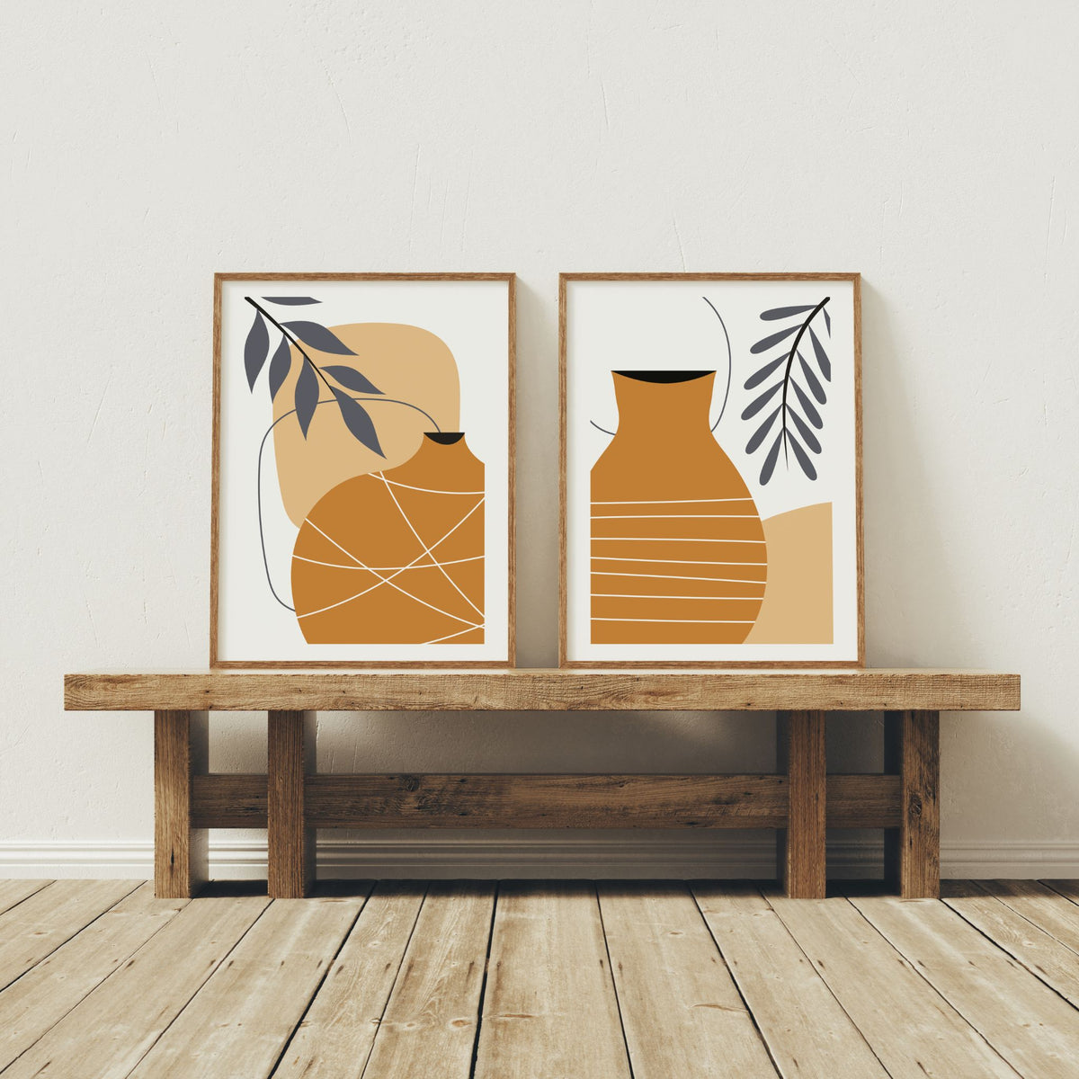 Golden Vessel og Terra Vessel boho-plakater i trerammer på rustikk benk