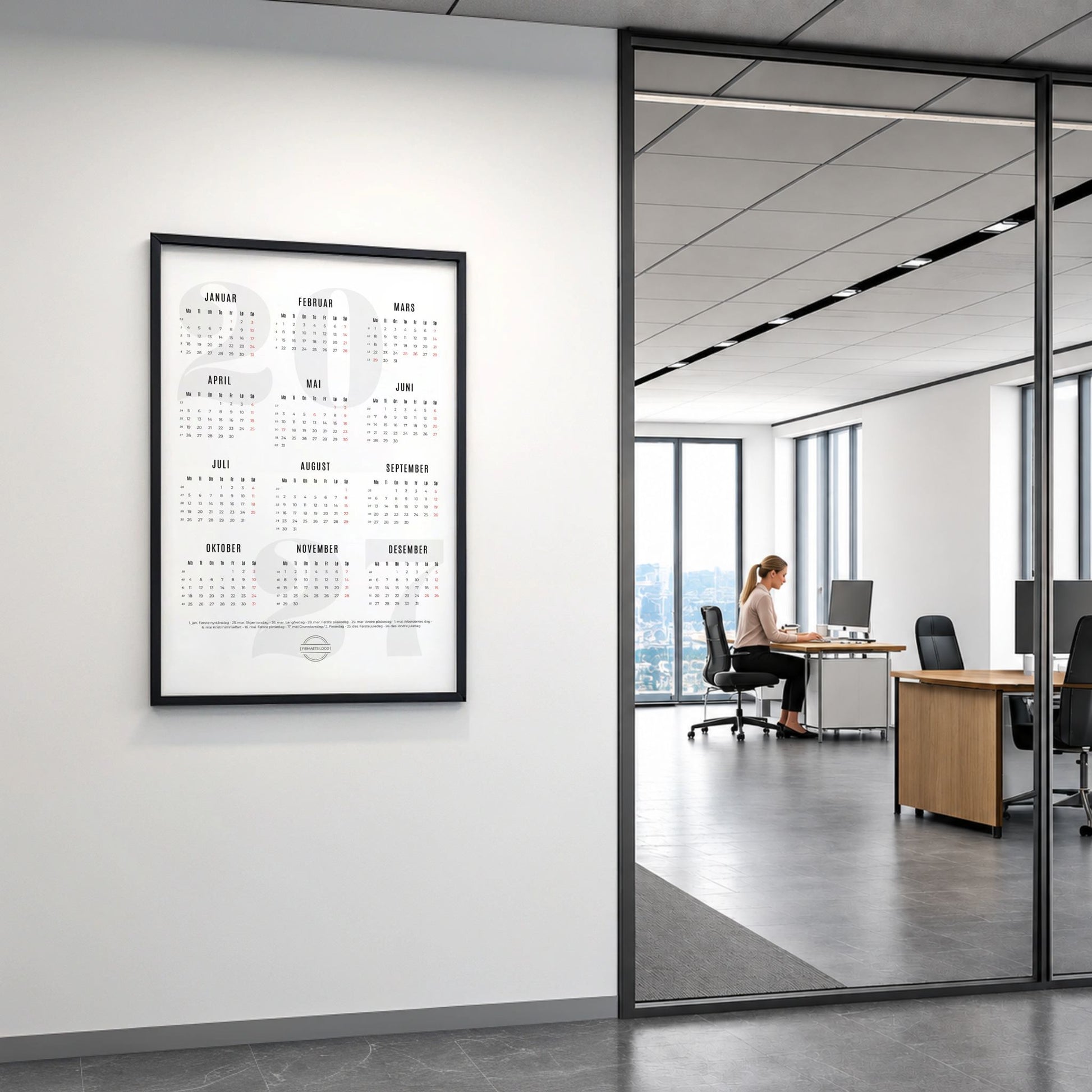 Kalender 2027 med firmalogo vist i moderne kontormiljø