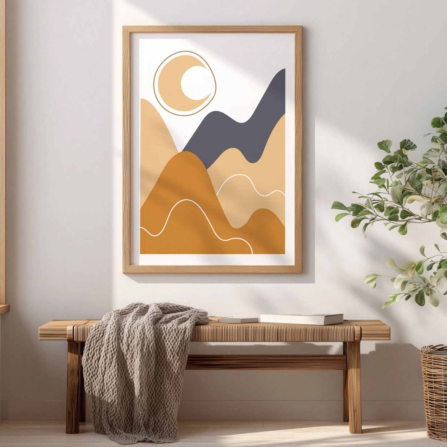 Moonlit Hills boho-plakat med måne og abstrakt landskap i eikeramme over trebenk