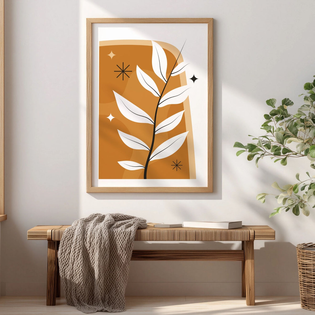 Golden Branch botanisk boho-plakat i eikeramme over trebenk i lyst interiør