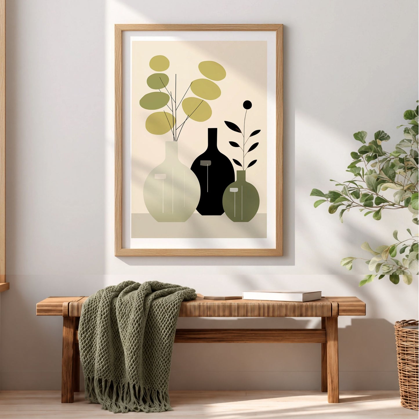 Quiet Botanicals plakat i eikeramme over trebenk med dempet grønt pledd