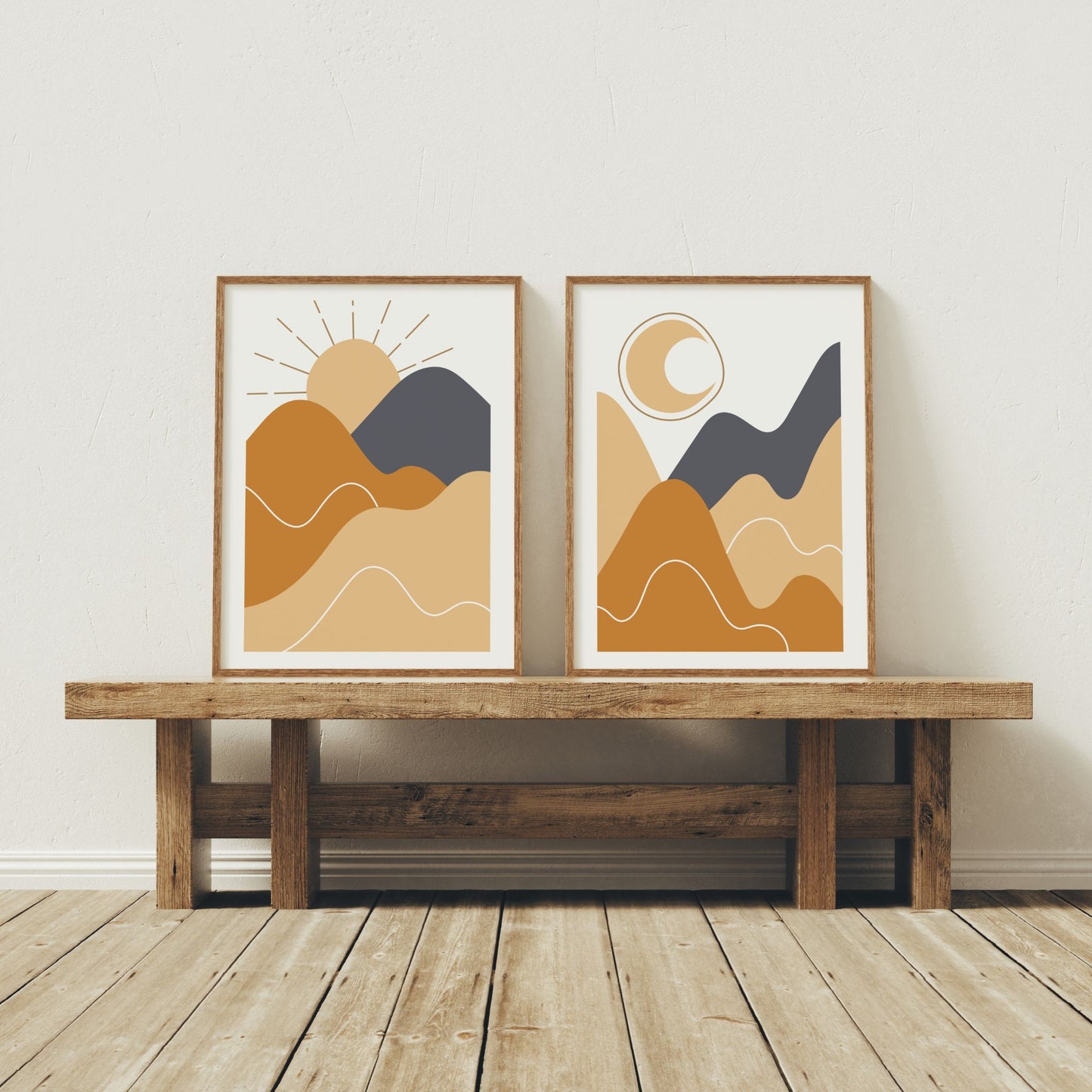 Rising Sun og Moonlit Hills boho-plakater i trerammer på rustikk benk