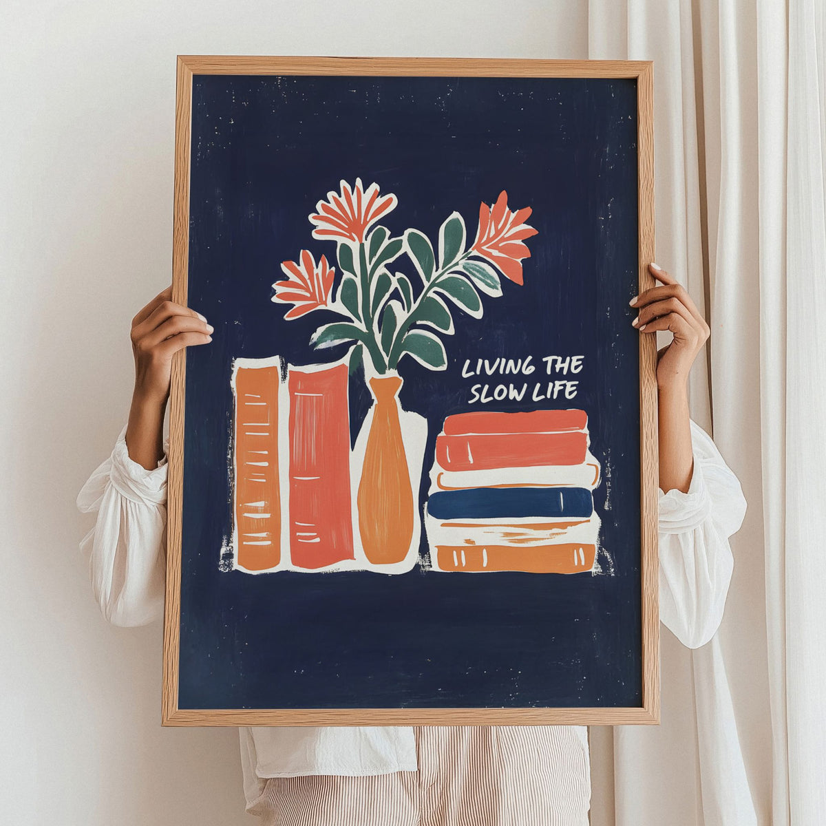 Slow Living Stories kunstplakat holdt opp i eikeramme som inspirasjon til innramming