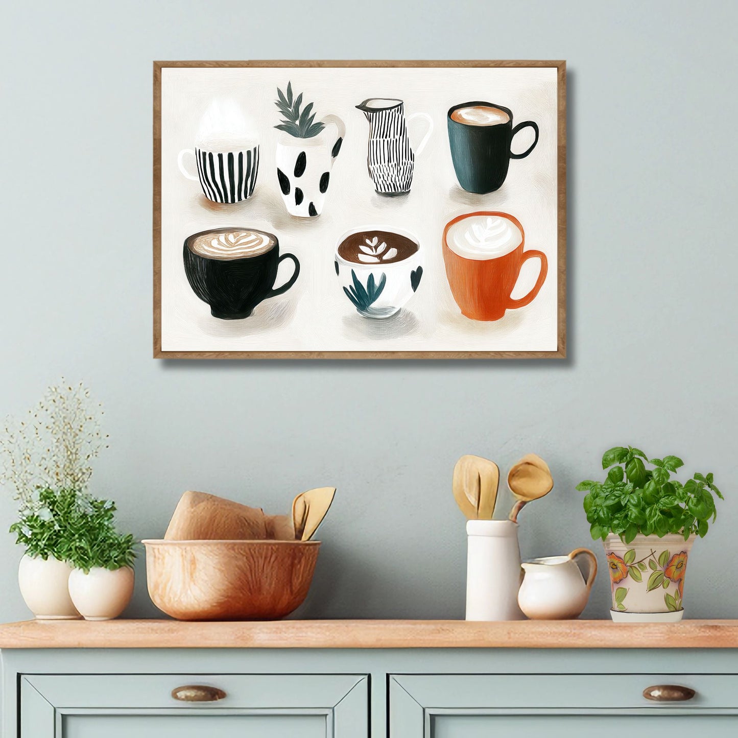 Stilren plakat med kaffekopper og keramikk i varme jordtoner og rolig uttrykk fra serien Still Life & Everyday Calm. Miljøbilde av plakat i eik ramme på kjøkken.