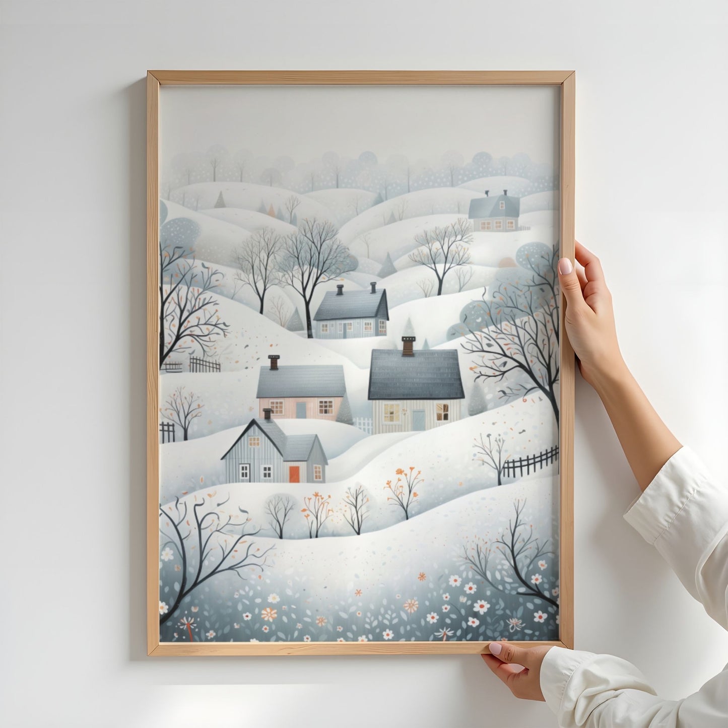 Vinterdalen plakat med snødekte åser, små hus og rolige nordiske vinterfarger. Illustrasjon viser plakat uten hvit kantlinje i eik ramme.