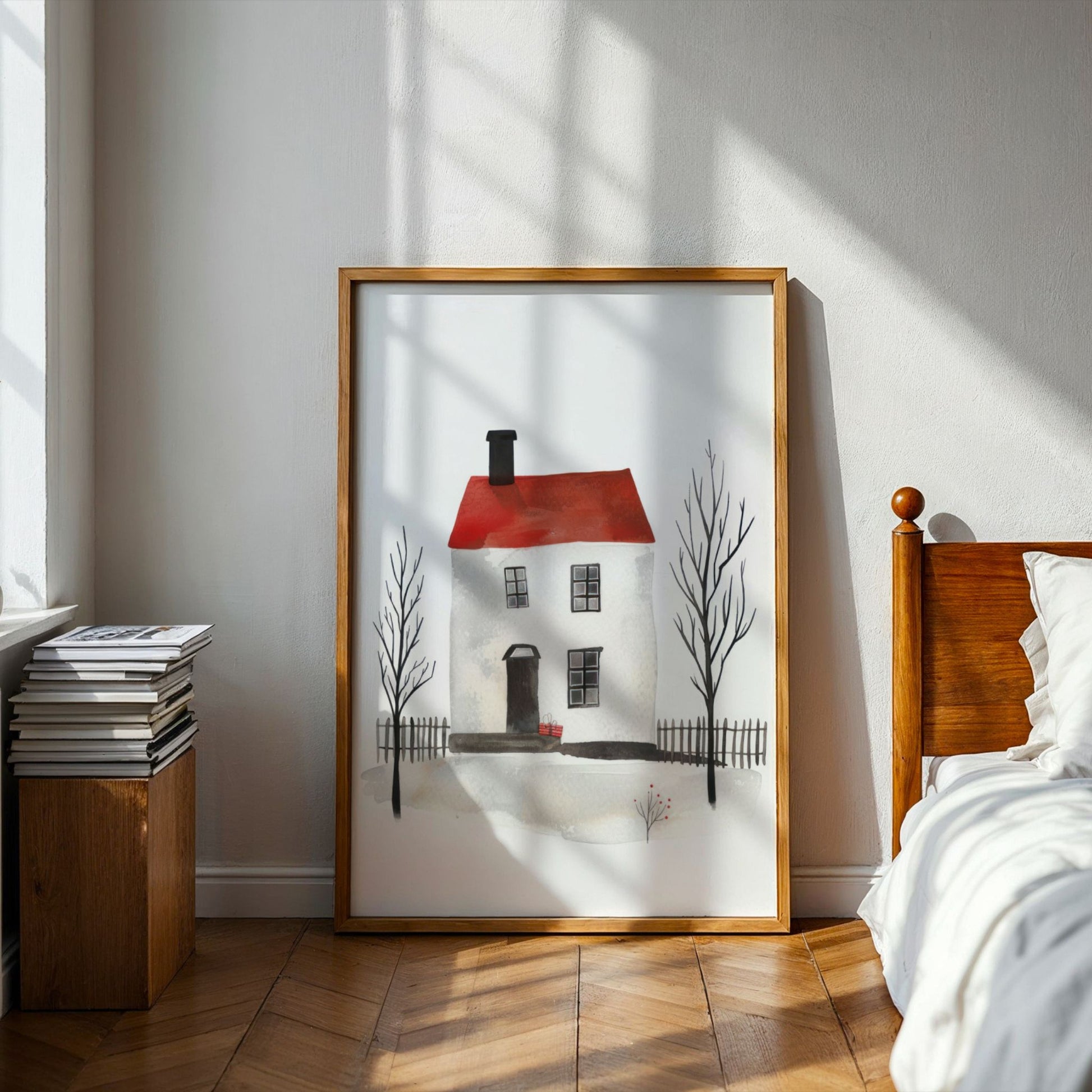 Grafisk kunstplakat av hvitt hus med rødt tak og nakne trær i vinterlandskap – minimalistisk akvarellmotiv i nordisk stil. Illustrasjon viser plakat i ramme på et soverom.