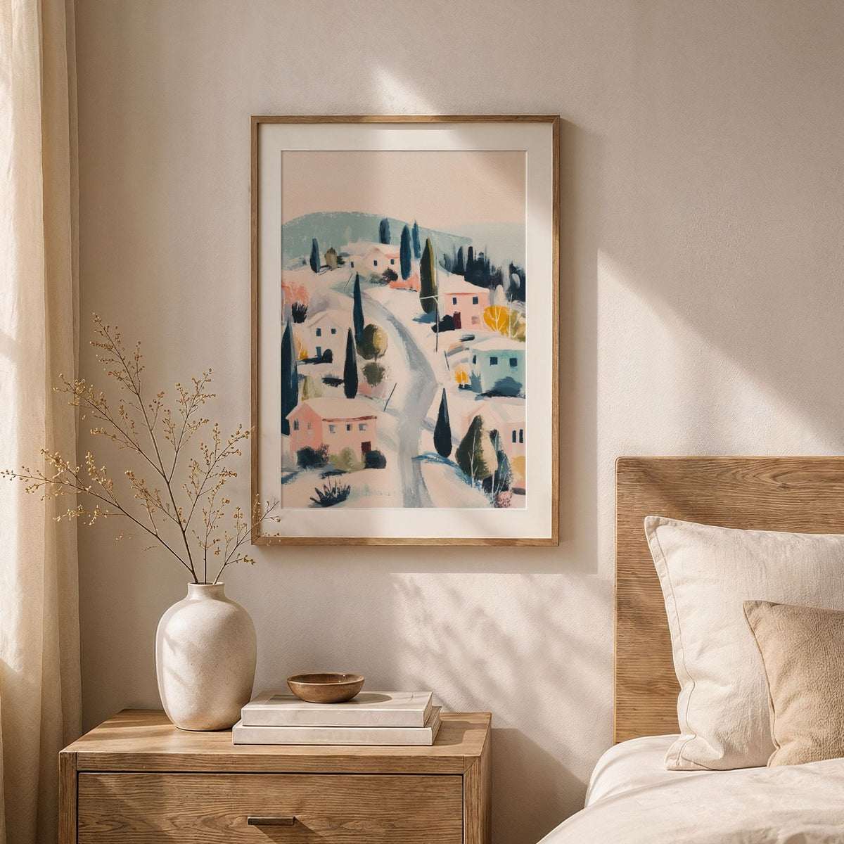 Winter Village vinterplakat med hvit passepartout i lyst soverom med naturmaterialer.
